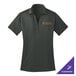 A steel gray Port Authority women's short sleeve polo shirt with a logo on it.