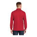 A man wearing a Sport-Tek True Red long sleeve polo shirt.