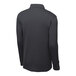 A back view of a black long sleeve Sport-Tek polo shirt.