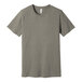 A heather stone unisex Bella + Canvas t-shirt with a small logo on the front.