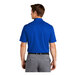 A man wearing a blue Nike polo shirt.