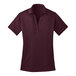 A maroon Port Authority short sleeve polo shirt with a collar.