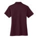 A Port Authority maroon short sleeve polo shirt for women.