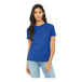 A woman wearing a Bella + Canvas heather true royal short sleeve t-shirt.
