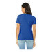 A woman wearing a Bella + Canvas blue short sleeve t-shirt.