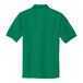 A Port Authority Kelly Green polo shirt.