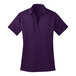 A Port Authority bright purple short sleeve polo shirt for women.