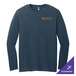 A District navy long sleeve T-shirt with a gold logo on a counter.