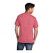 A man wearing a red Port & Company heather red short sleeve T-shirt.