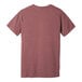 A heather mauve Bella + Canvas customizable short sleeve t-shirt with a small logo on the front and the back.