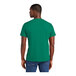 A man wearing a District Jewel Green t-shirt.