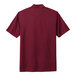 A Nike team red polo shirt.