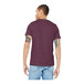 A man wearing a maroon Bella + Canvas customizable short sleeve t-shirt.