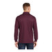 A man wearing a Sport-Tek unisex maroon long sleeve polo shirt.