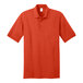 An orange Port & Company jersey knit polo shirt with a collar and short sleeves.