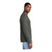 A person wearing a District Deepest Gray long sleeve t-shirt.