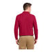 A man wearing a red Port Authority® long sleeve polo shirt.