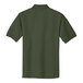 A back view of a Port Authority clover green polo shirt.