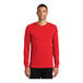 A man wearing a red Nike Dri-FIT long sleeve t-shirt.
