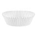 A close-up of a 3 1/2" x 1 1/2" white fluted jumbo baking cup.