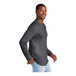 A man wearing a heathered charcoal long sleeve t-shirt.