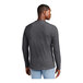 A man wearing a heathered charcoal long sleeve t-shirt.