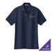 A medium navy Port Authority women's polo shirt with a logo on it.