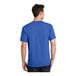 A man wearing a royal blue Port & Company short sleeve t-shirt.