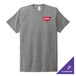 A grey AllMade customizable tri-blend t-shirt with a logo on it.