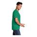 A man wearing a Port & Company Kelly green short sleeve t-shirt.