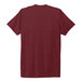 The back of a red AllMade short sleeve T-shirt with a white logo.