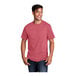 A man wearing a heather red Port & Company short sleeve T-shirt.