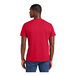 A man wearing a classic red District T-Shirt.