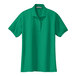 A close-up of a Port Authority kelly green women's short sleeve polo shirt.