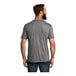 A man with a beard wearing a customizable grey AllMade T-shirt.