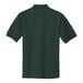The back of a dark green Port Authority silk touch polo shirt.