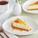 A slice of cheesecake with DaVinci Sugar Free Caramel Sauce on top.
