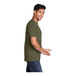 A man wearing a Port & Company olive green short sleeve T-shirt.