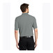 A man wearing a Port Authority Cool Gray Silk Touch Pique Polo Shirt.