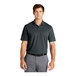 A man wearing a dark gray Nike Dri-Fit polo shirt.