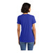 A woman wearing a deep royal blue District short sleeve t-shirt.