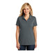 A woman wearing a graphite grey Port Authority Dry Zone polo shirt with a collar.