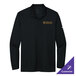 A black Nike long sleeve polo with a logo on the counter.