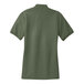 A back view of a Port Authority women's clover green polo shirt with a white collar.