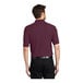 A man wearing a maroon Port Authority® Silk Touch™ polo shirt.