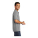 A man wearing a Port & Company athletic heather polo shirt.