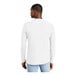 A man wearing a white District long sleeve shirt.