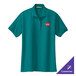 A teal green Port Authority women's polo shirt with a logo on the chest.