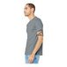 A man wearing a Bella + Canvas athletic heather short sleeve t-shirt in grey.