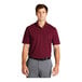 A man wearing a burgundy Nike polo shirt.